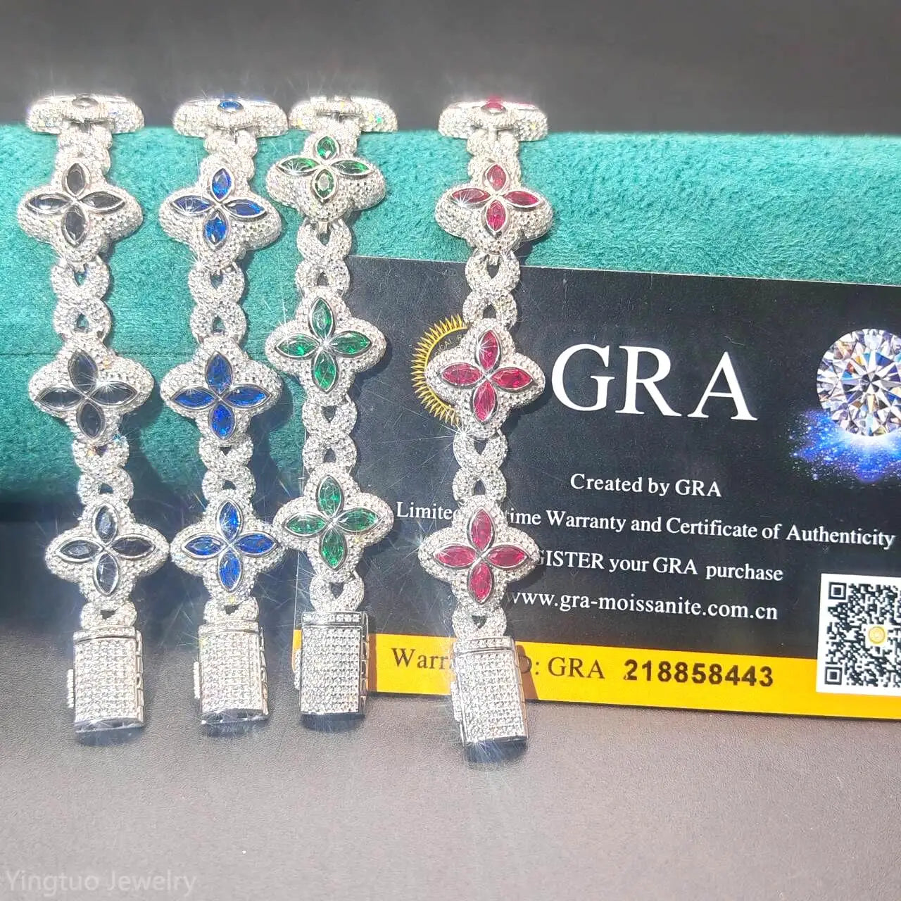 Four diamond-encrusted bracelets on a GRA branded card with a gray background